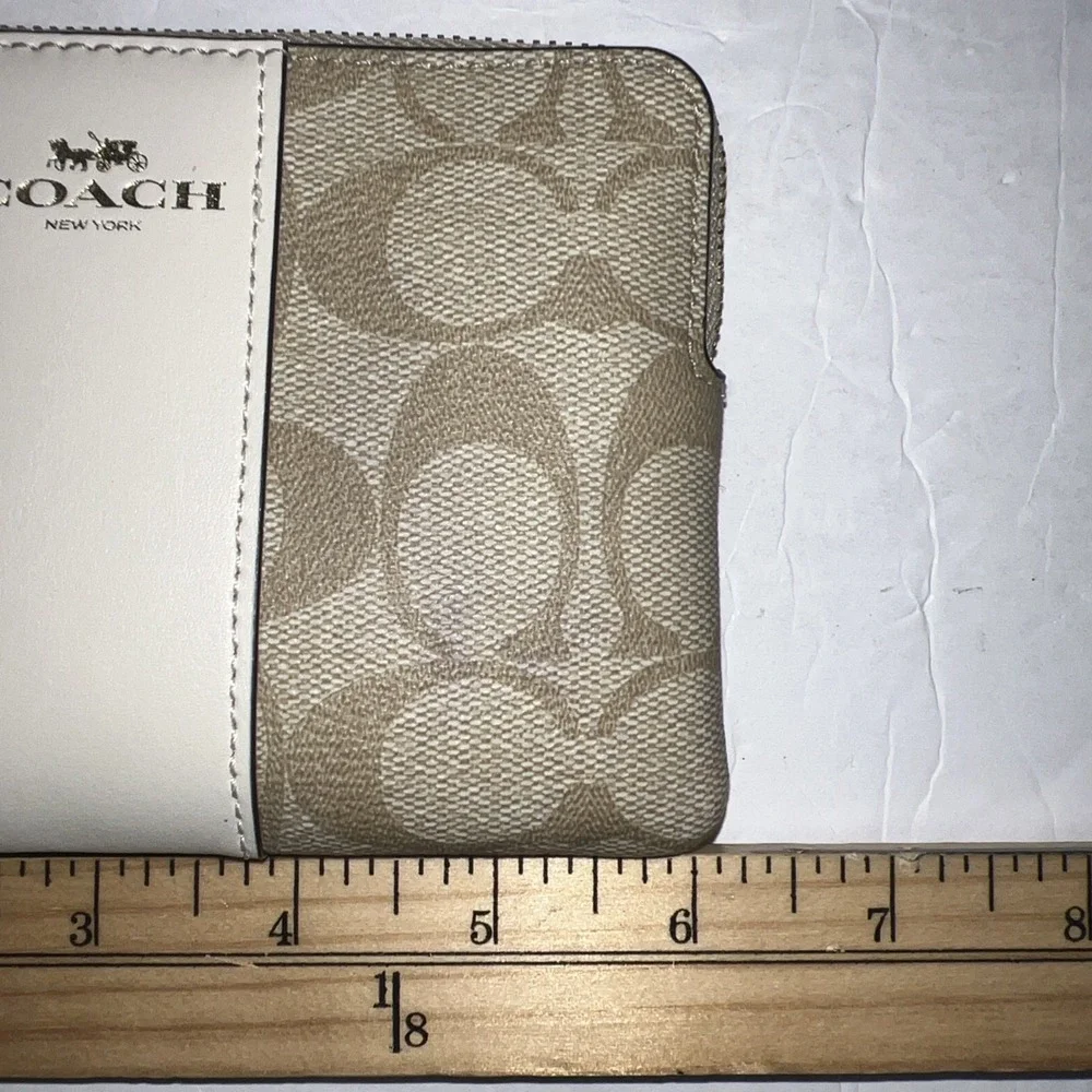 COACH Corner Zip Wristlet in Signature Canvas Stripe Gold Tone Logo Cream/Sand